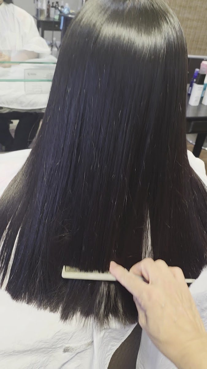 Sleek, glossy straight hair after Japanese hair straightening
