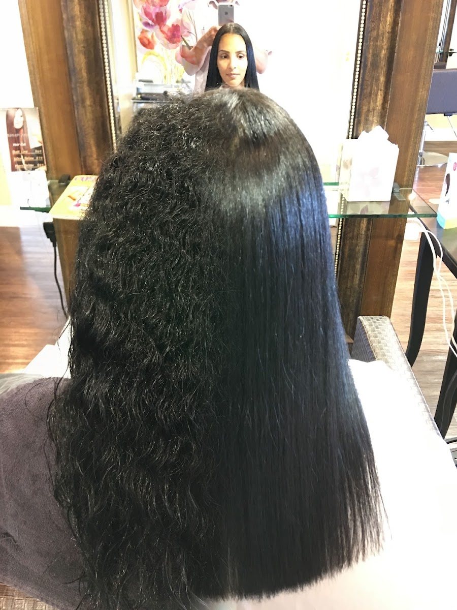 Halfway through: straightened on one side, natural curl on the other